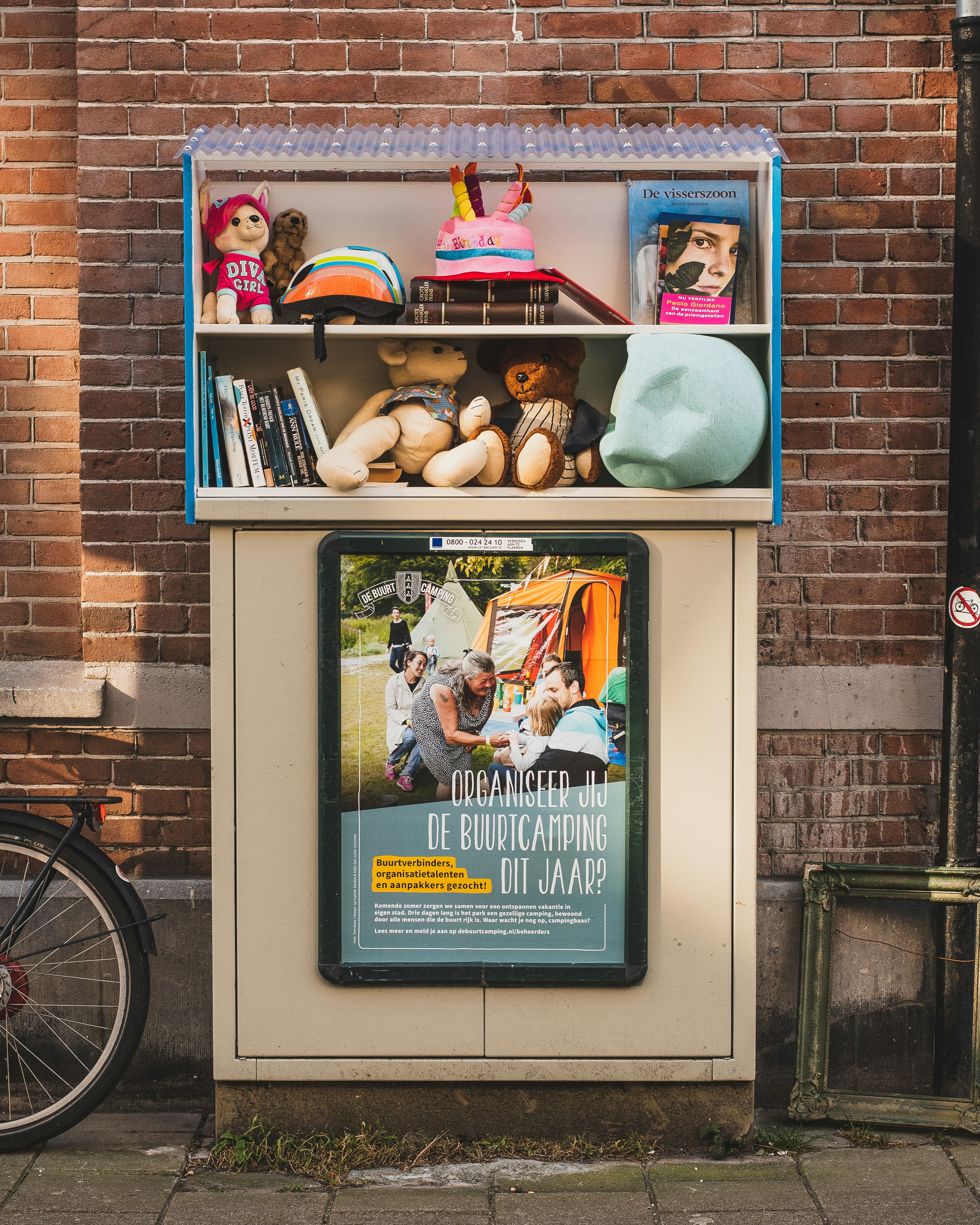 Community sharing shelf with books and items for exchange